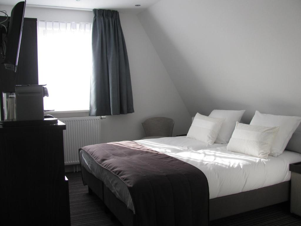 Boutique Hotel De Zwaluw De Koog  Room photo